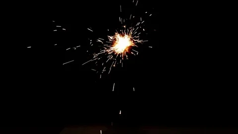 Burning sparkler on black background Stock Footage 113209672