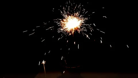 Burning sparkler on black background Stock Footage 113210175