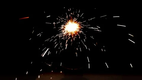 Burning sparkler on black background Stock Footage 113210644