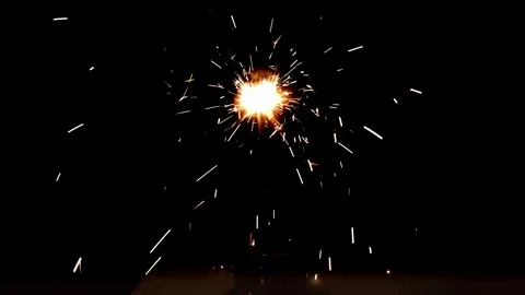 Burning sparkler on black background Stock Footage 113210705