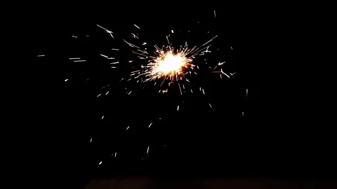 Burning sparkler on black background Stock Footage 113210991