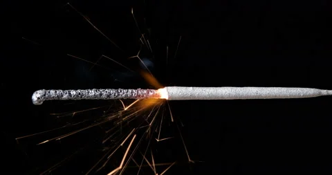 Burning sparkler on a black background Stock Footage 234968852
