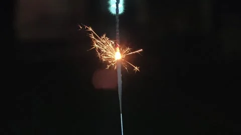 Burning sparkler on a black background Stock Footage 304647181