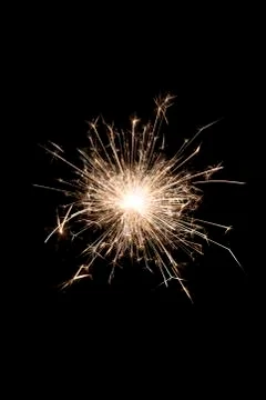 A burning sparkler on a black background Foto stock