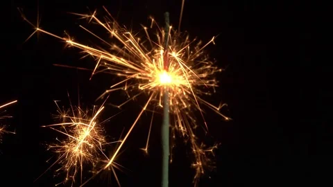 Burning sparkler closeup Stock Footage 104086535