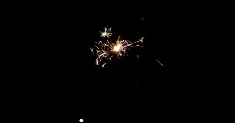 Burning sparkler isolated on black background with alpha channel. Celebration Stock Footage 147107472