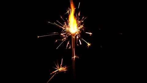 Burning sparkler isolated on black background. Festive Sparkler Stock Footage 166025397