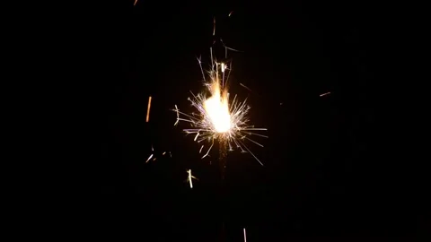 Burning sparkler isolated on black background Stock Footage 282578927