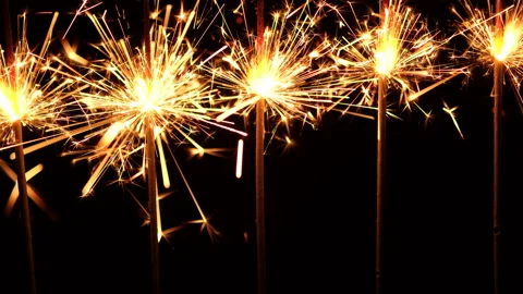 Burning sparklers on black background. Burning New Year sparklers Stock-Footage 166598189