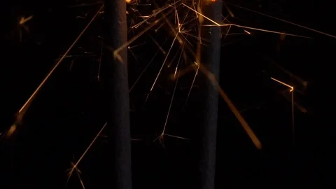 Burning sparklers in the dark Stockbeeldmateriaal 70918167