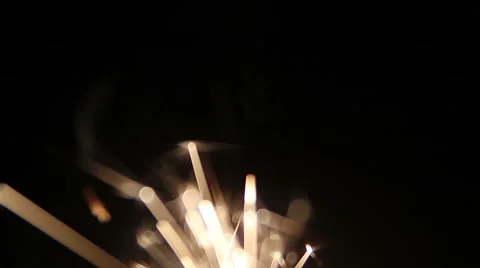 Burning sparklers. Firework sparkler burning isolated in slow-motion from top in Stock Footage 58874904