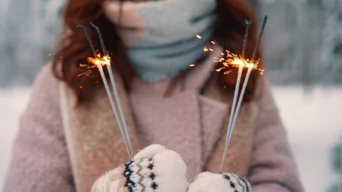 Burning sparklers in woman's hands, selective focus Stock Footage 101053480