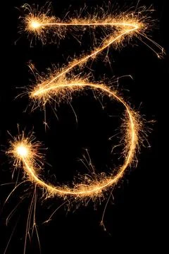 Burning Sparkling number 0 zero isolated on black background. Beautiful Glowing Stock Photos