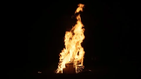 Burning stacked pallets at night mid shot 6K Stock Footage 291531905