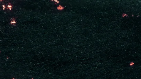 Burning steel wool spinning in a vortex of sparks Stock Footage 302803845