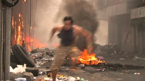 BURNING STREET CIVIL WAR Man Runs Terrorist Attack Smoking Ruins Bombed City Stock Footage