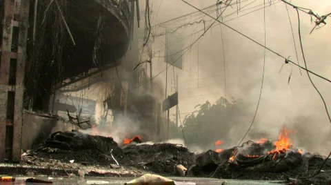 BURNING STREET CIVIL WAR Terrorist Attack Smoking Ruins Bombed City End of World Stock Footage