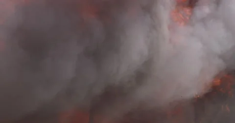Burning structure with roiling smoke and bursts of flame Stock Footage 59528237