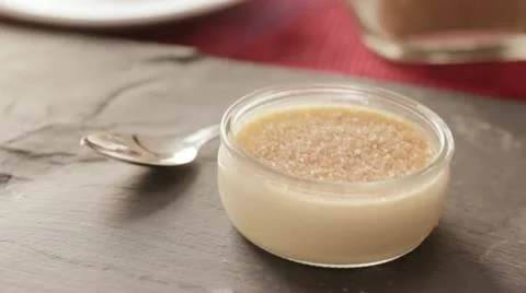 Burning sugar on creme brulee Stockbeeldmateriaal 10804840