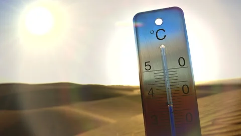 A burning sun shines on a thermometer stuck in the sand. Stock Footage 264801246