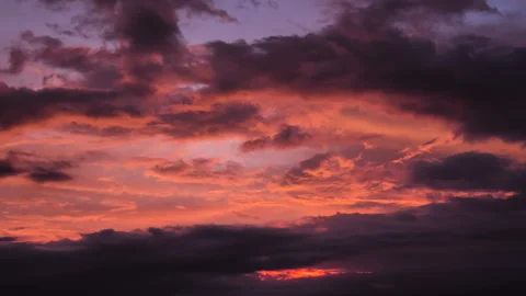 Burning Sunset Clouds Transforming During Twilight. Vibrant Sunset Sky Painting Stock Footage 305374622
