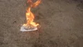 burning a surgical mask 4k or 4k+ Resolution