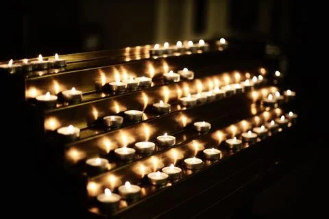 Burning tea candles Stock Photos