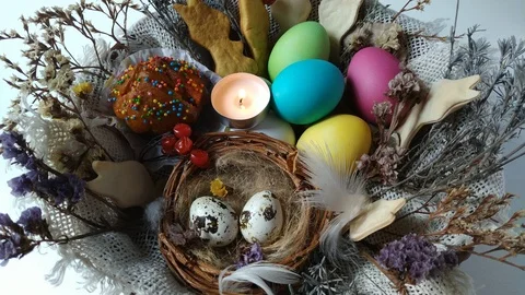 Burning tea light candle in a Easter basket Stock Footage 105100971