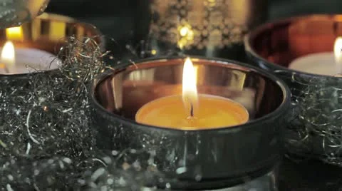 A burning tealight with Christmas decorations Stock-Footage 24668791