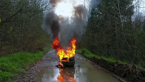 Burning tires on the road Stock Footage 170773339