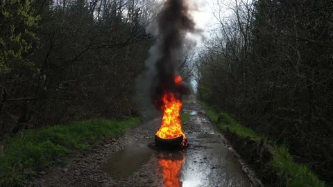 Burning tires on the road Stock Footage 170773471