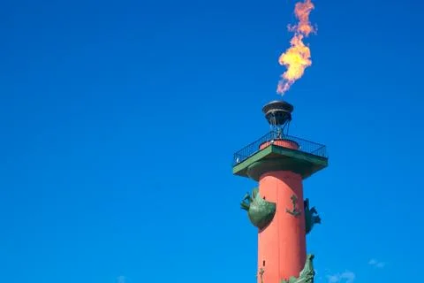 Burning torch Rostral columns in St. Petersburg on victory day closeup Stock Photos