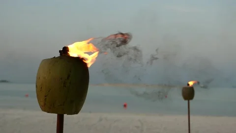 Burning torches on the background of the ocean Stock Footage 147357915