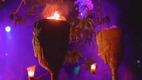 Burning torches for a nighttime performance fire show Stock Photos