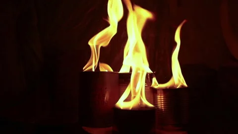 Burning trench candles. Close-up of burning trench candles in a dark dugout Stock Footage 260467486