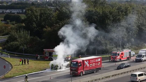 Burning truck on the highway Stock Footage 80371514
