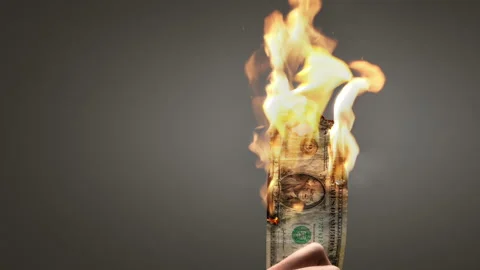 Burning US Dollar Bill Held by Hand Video stock 303142805