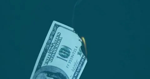 Burning US one hundred dollar bill at right edge over teal background, with Illustrazione stock