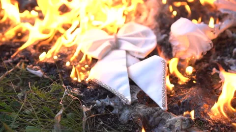 Burning white bow tie on ground Stock Footage 96085463