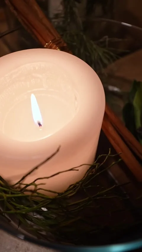 Burning White Candle in Rustic Wreath Close Up Vertical Video stock 328850953