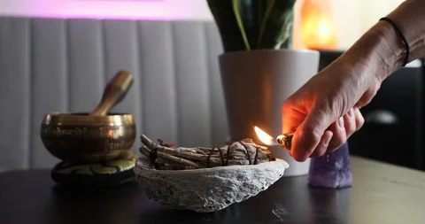 Burning white sage to clear negative energies Stock Footage 129409735
