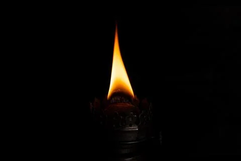 Burning wick on in the dark Stock Photos