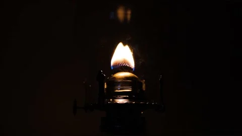 A burning wick on a lantern at night Stock Footage 164414170