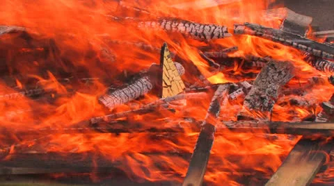 Burning wood blown by wind Stock Footage 26118934