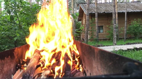 Burning wood in a brazier. Strong fire in the grill. Stock Footage 64017835