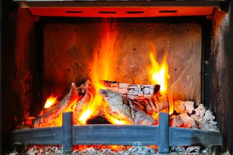 Burning wood in the fireplace Stock Photos