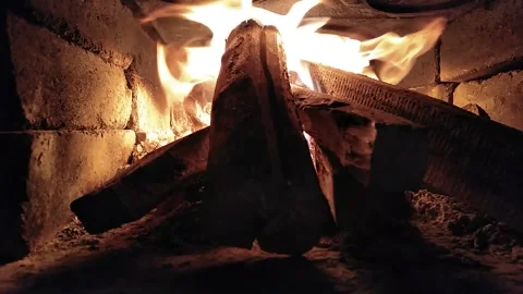 Burning wood inside a fireplace Stock Footage 141010733