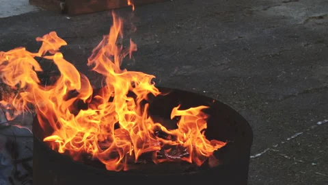 Burning wood in a metal bin Stock Footage 130847654