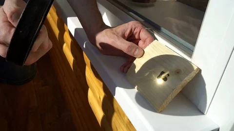 Burning on the wood pattern . with the help of magnifying glass burns on a Stock Footage 77848880