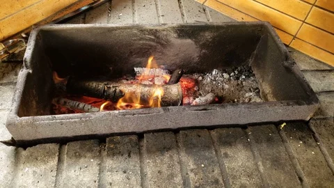 Burning woods in fire and hot traditional dish in huge pot, countryside cooking 動画素材 119032508